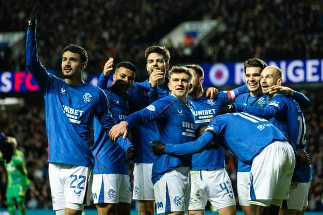 The Rangers players celebrate Danilo's goal making it 3-0 against Celtic.