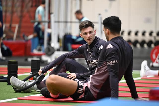 Celtic target Kieran Tierney speaks to Arsenal teammate Mikel Merino during a training session at Sobha Realty Training Centre on December 31, 2024. (Photo by Stuart MacFarlane/Arsenal FC via Getty Images)