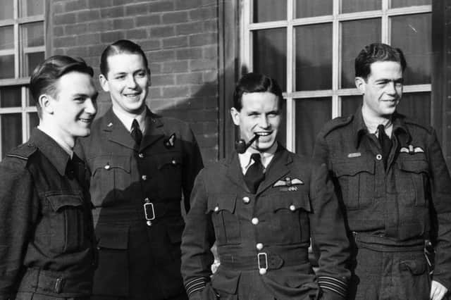 Wing Commander Guy Gibson, smoking pipe, pictured with members of his Lancaster crew in January 1943 (Picture: Central Press)