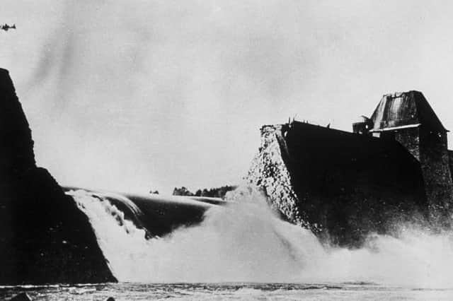 Water floods through a gap in the Mohne Dam after being bombed in the Dambusters Raid. The photograph was discovered in German archives after the war (Picture: Keystone)