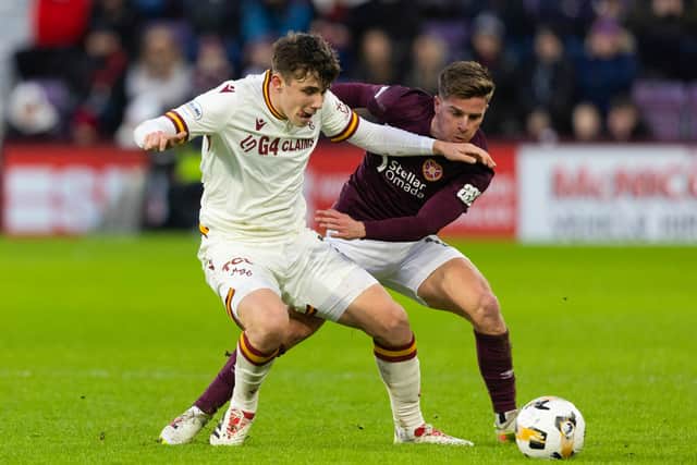 Hearts' Cammy Devlin and Motherwell's Tom Sparrow in action during the William Hill Premiership match at Tynecastle Park, on January 02, 2025. (Photo by Mark Scates / SNS Group)