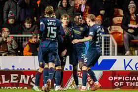 Hearts' James Penrice celebrates with teammates after scoring the winning goal against Dundee United at Tannadice. (Photo by Paul Devlin / SNS Group)