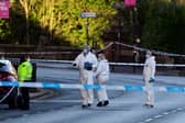 Forensics officers on the scene in Glasgow. Picture: John Devlin