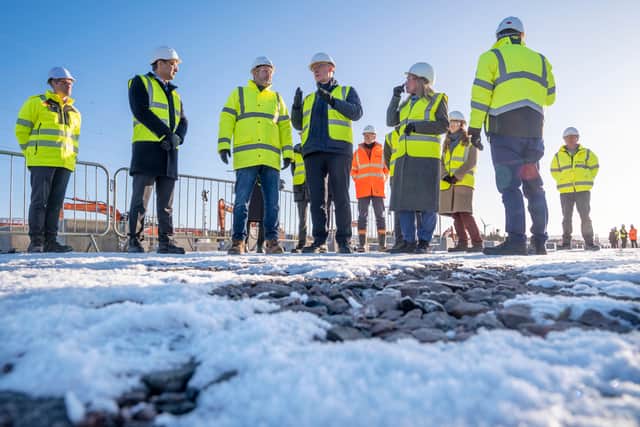 First Minister John Swinney (centre) during a visit to the Coalburn 1 battery energy storage site in Lanark, South Lanarkshire