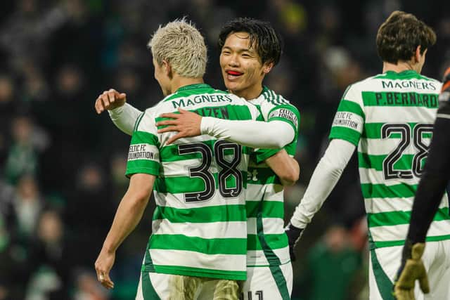 Celtic's Reo Hatate celebrates with Daizen Maeda after scoring to make it 2-0 over Dundee United. (Photo by Craig Foy / SNS Group)