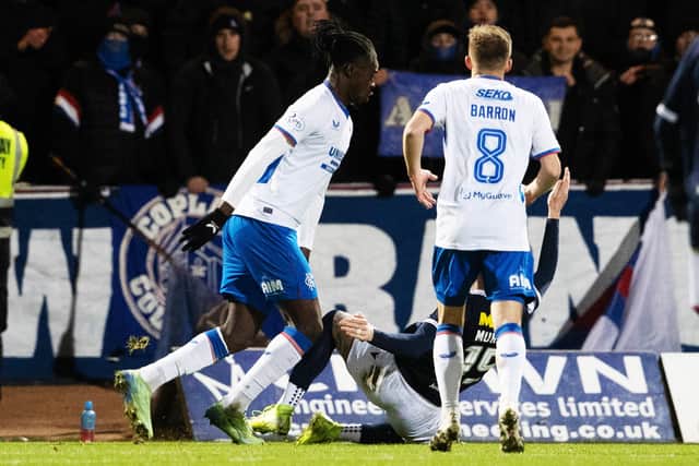 A penalty appeal for Dundee as Simon Murray goes down in the box under a challenge from Rangers Clinton Nsiala.
