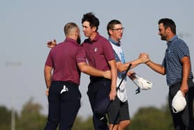 Tyrrell Hatton and Tom McKibbin celebrate after winning their match during day one of the Team Cup at Abu Dhabi Golf Resort