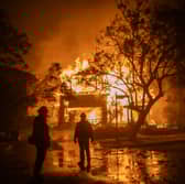A wildfire engulfs a home in the Pacific Palisades area of Los Angeles earlier this week (Picture: Apu Gomes)