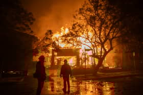 A wildfire engulfs a home in the Pacific Palisades area of Los Angeles earlier this week (Picture: Apu Gomes)