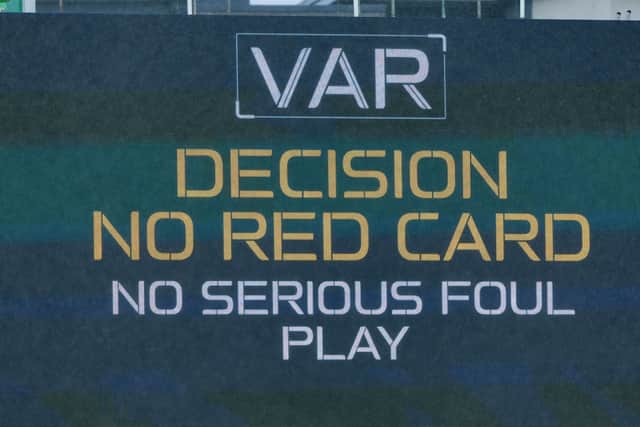 The big screen at Easter Road shows there is no VAR intervention for a red card after Rangers midfielder Mohamed Diomande fouled Hibs winger Chris Cadden. (Photo by Ross Parker / SNS Group)