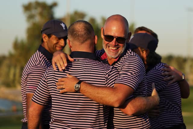 Paul Waring celebrates with Tyrrell Hatton during day two of the Team Cup in Abu Dhabi