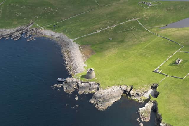 Aerial view centred on the Broch of Mousa with The Haa and the burnt mound adjacent.