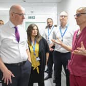 John Swinney, seen visiting Forth Valley Hospital, has said he is giving 'very personal leadership' to the NHS (Picture: Lesley Martin)