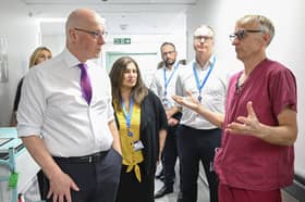 John Swinney, seen visiting Forth Valley Hospital, has said he is giving 'very personal leadership' to the NHS (Picture: Lesley Martin)