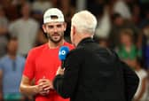 Jacob Fearnley speaks to John McEnroe at the Australian Open.
