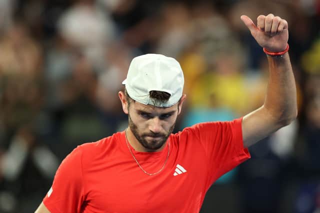 Jacob Fearnley celebrates winning match point against Nick Kyrgios of Australia in the Men's Singles First Round match during day two of the 2025 Australian Open at Melbourne Park.