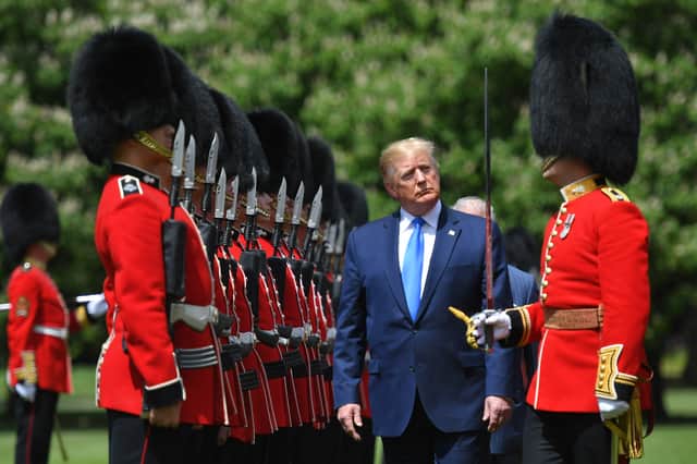 Donald Trump inspects an honour guard at Buckingham Palace during his state visit in 2019 (Picture: Mandel Ngan)