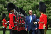 Donald Trump inspects an honour guard at Buckingham Palace during his state visit in 2019 (Picture: Mandel Ngan)