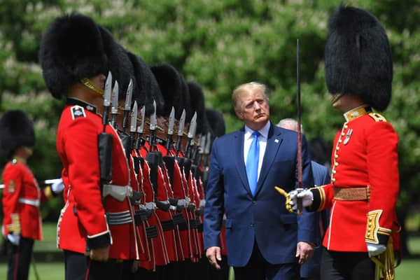 Donald Trump inspects an honour guard at Buckingham Palace during his state visit in 2019 (Picture: Mandel Ngan)