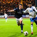 Dundee’s Josh Mulligan (left) challenges Rangers’ Jefte during a recent meeting between the clubs.