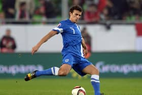 Roman Eremenko, pictured in action for Finland in 2014, is on trial on St Johnstone. Pic: ATTILA KISBENEDEK/AFP via Getty Images