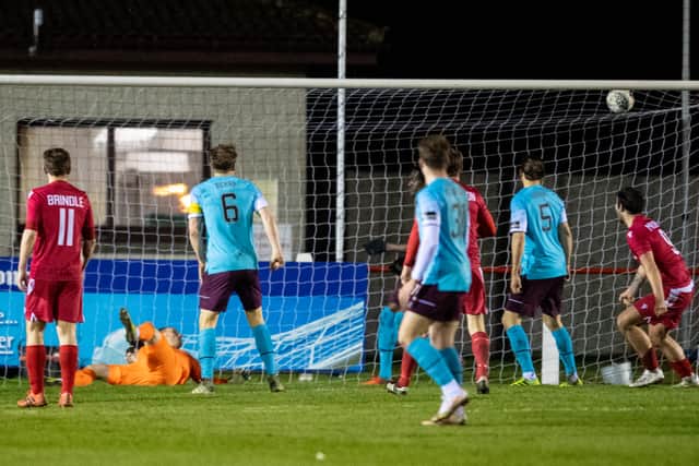 Martin MacLean scores to make it 2-1 to Brora against Hearts in 2021.
