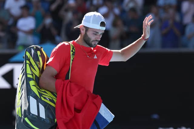 Jacob Fearnley leaves the court following his defeat to Alexander Zverev at the Australian Open. (Photo by DAVID GRAY/AFP via Getty Images)