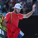 Jacob Fearnley leaves the court following his defeat to Alexander Zverev at the Australian Open. (Photo by DAVID GRAY/AFP via Getty Images)
