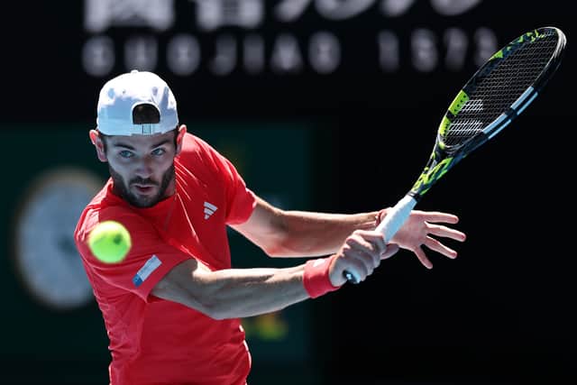 Jacob Fearnley plays a backhand against Alexander Zverev in the Australian Open third round match. (Photo by Clive Brunskill/Getty Images)