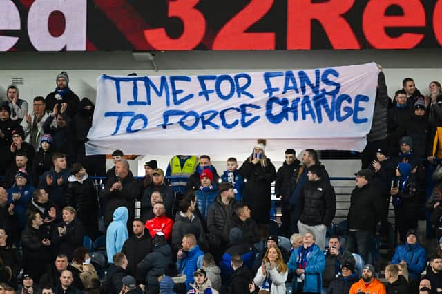 Rangers fans hold a banner during the midweek win over Aberdeen at Ibrox.  (Photo by Rob Casey / SNS Group)