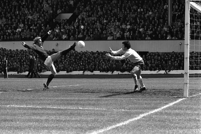 Denis Law (left) attempts to lob England keeper Gordon Banks in 1972.