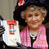 Actress Joan Plowright poses for pictires after being made a Dame by the Prince Of Wales at Buckingham Palace in London, 20 February, 2004.