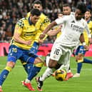 Las Palmas defender Scott McKenna keeps a close eye on Real Madrid striker Endrick during the La Liga clash at the Santiago Bernabeu. (Photo by JAVIER SORIANO/AFP via Getty Images)