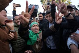 Palestinians celebrate the ceasefire agreement between Hamas and Israel at Al-Aqsa Hospital in Deir al-Balah, on the central Gaza Strip. Picture: AP Photo/Abdel Kareem Hana