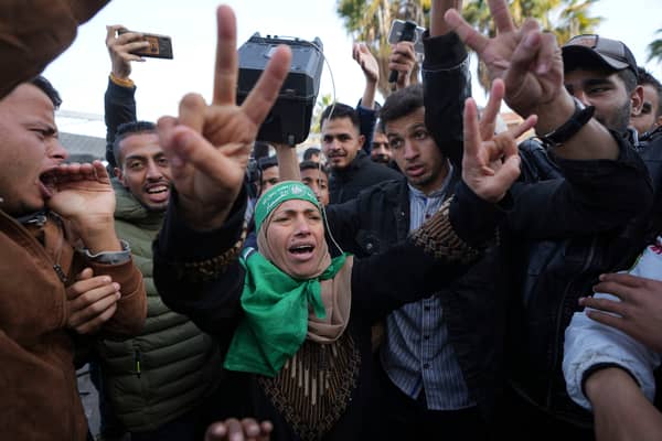 Palestinians celebrate the ceasefire agreement between Hamas and Israel at Al-Aqsa Hospital in Deir al-Balah, on the central Gaza Strip. Picture: AP Photo/Abdel Kareem Hana