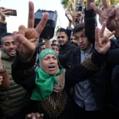Palestinians celebrate the ceasefire agreement between Hamas and Israel at Al-Aqsa Hospital in Deir al-Balah, on the central Gaza Strip. Picture: AP Photo/Abdel Kareem Hana