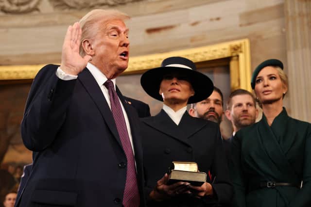 President Donald Trump takes the oath of office next to wife Melania Trump and daughter Ivanka Trump. Credit: CHIP SOMODEVILLA/AFP via Getty Images