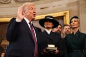 Donald Trump takes the oath of office next to wife Melania Trump and daughter Ivanka Trump. Picture: Chip Somodevilla/AFP/Getty 