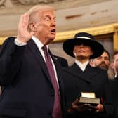Donald Trump takes the oath of office next to wife Melania Trump and daughter Ivanka Trump. Picture: Chip Somodevilla/AFP/Getty 
