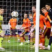 Dundee striker Simon Murray scores with a first-minute header against Dundee United in the Scottish Cup fourth round.  (Photo by Craig Williamson / SNS Group)