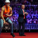 President-elect Donald Trump dances with The Village People at a rally ahead of the 60th Presidential Inauguration. Picture: AP Photo/Evan Vucci