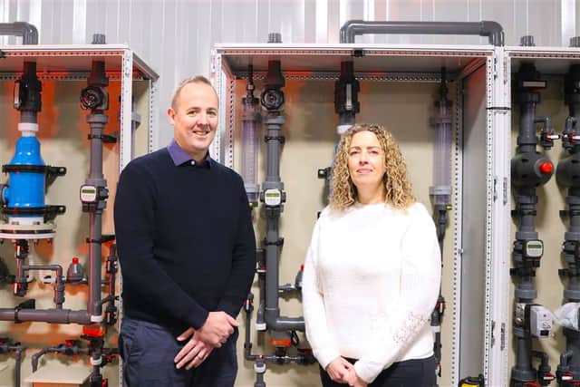 Scotmas CEO, Alistair Cameron, and Commercial Director, Nicola Cameron, in front of their advanced water disinfection equipment.