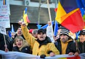 Supporters of Romanian nationalist party AUR and presidential candidate Calin Georgescu attend a march in Bucharest to protest against the annulment of the presidential election. (Picture: Daniel Mihailescu) 