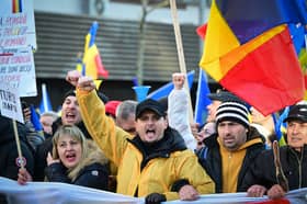 Supporters of Romanian nationalist party AUR and presidential candidate Calin Georgescu attend a march in Bucharest to protest against the annulment of the presidential election. (Picture: Daniel Mihailescu) 