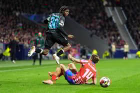 Bayer Leverkusen's Jeremie Frimpong is tackled by Marcos Llorente of Atletico Madrid during the Champions League match at the Metropolitano. (Photo by Angel Martinez/Getty Images)