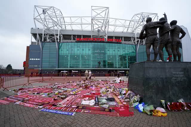 Tributes in memory of Denis Law, at the foot of the United Trinity Statue,  outside Old Trafford, home of Manchester United. Picture date: Wednesday January 22, 2025.