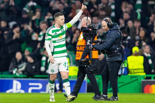 The captain salutes the Celtic fans at full-time.
