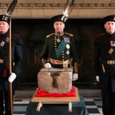 The Stone of Destiny is guarded before being taken to Westminster Abbey for the coronation of King Charles III (Picture: Russell Cheyne/pool)