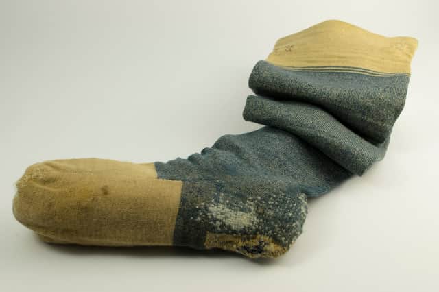 A blue woollen knitted sock owned by Robert Burns, complete with the initials "RB", is among the most popular of artefacts linked to the poet. The size eight socks date to around 1770-1796