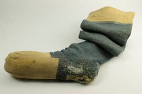 A blue woollen knitted sock owned by Robert Burns, complete with the initials "RB", is among the most popular of artefacts linked to the poet. The size eight socks date to around 1770-1796.